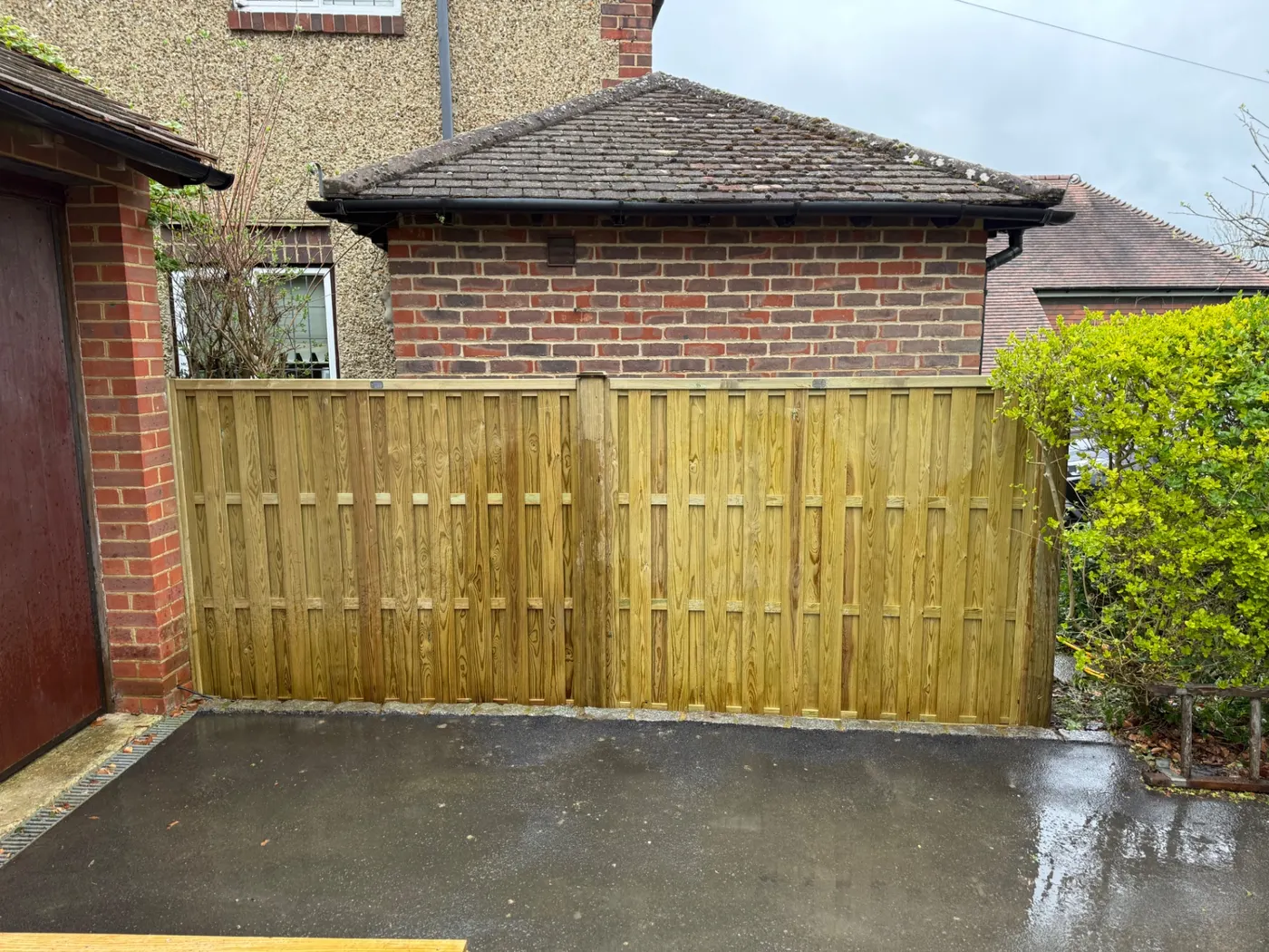 Tongue and groove timber driveway gates installed at a home